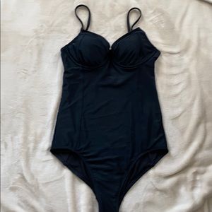 Black one piece swimsuit.